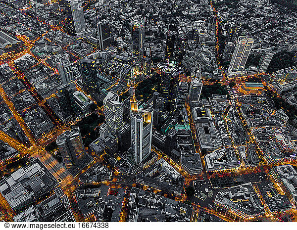Aerial Overhead View of Frankfurt am Main  Germany Skyline at Night with glowing Streets