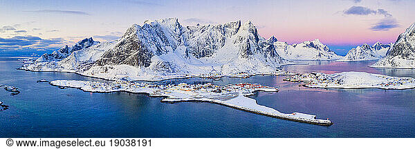 Aerial panoramic of Reine and snowy mountains  Norway