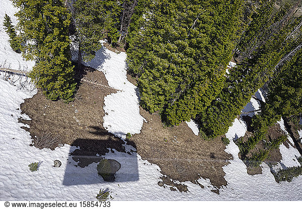 Aerial Tram shadow cast on snow covered land below