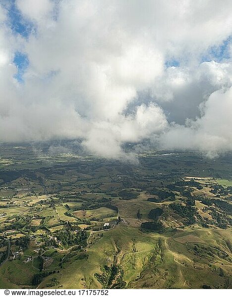Aerial view  hilly landscape  view of hills and fields with clouds  Clevedon  near Auckland  New Zealand  Oceania