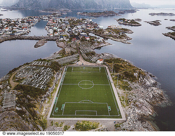 Aerial view of a soccer field and a city in islands