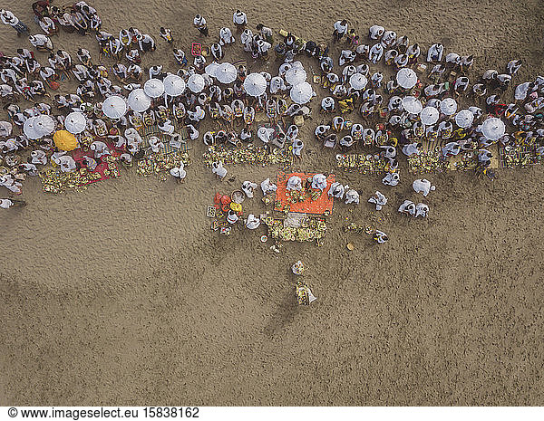 Aerial view of Balinese ceremony at the beach