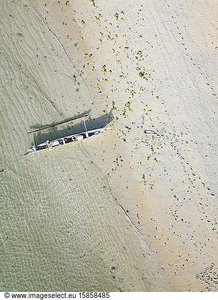 Aerial view of beach and banca boat