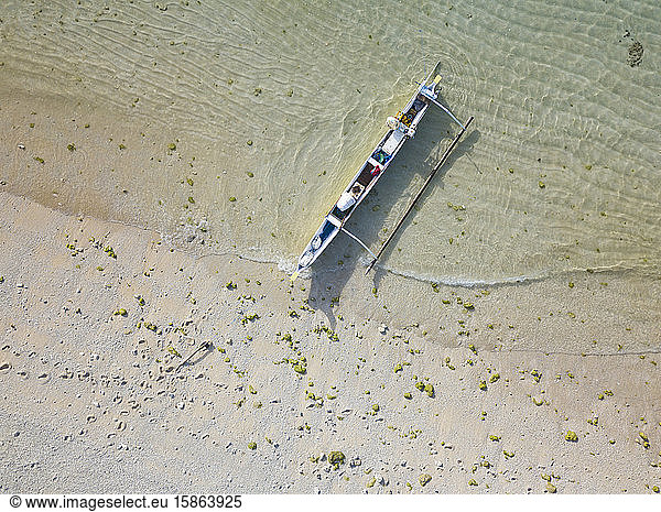 Aerial view of beach and banca boat