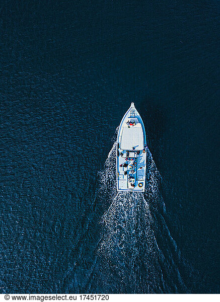 Aerial view of boat on blue water