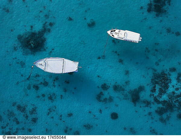 Aerial view of boats on blue water