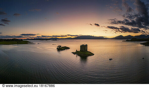 Aerial view of Castle Stalker on Loch Linnhe island at sunset  Scotland