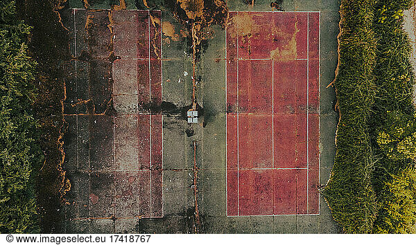 Aerial view of empty abandoned tennis courts