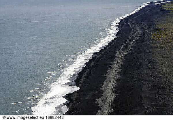 Aerial view of Endless black sand beach at Dyrholaey Peninsula  South Iceland