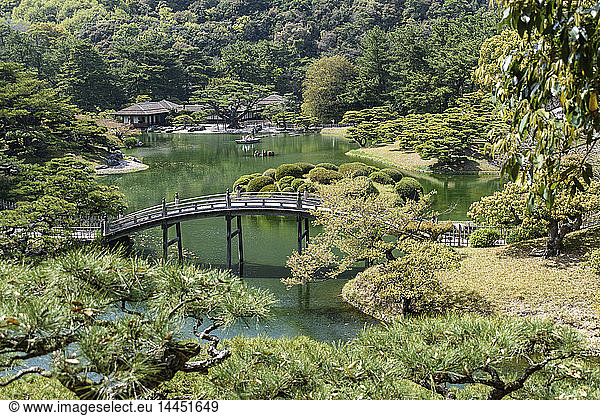 Aerial view of footbridge over ornamental pond  Takamatsu garden  Japan.