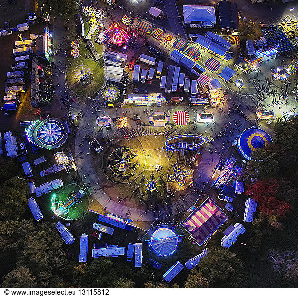 Aerial view of illuminated colorful amusement park