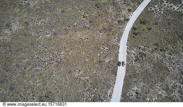 Aerial view of jeeps driving along a dirt track  Damaraland area  Namibia