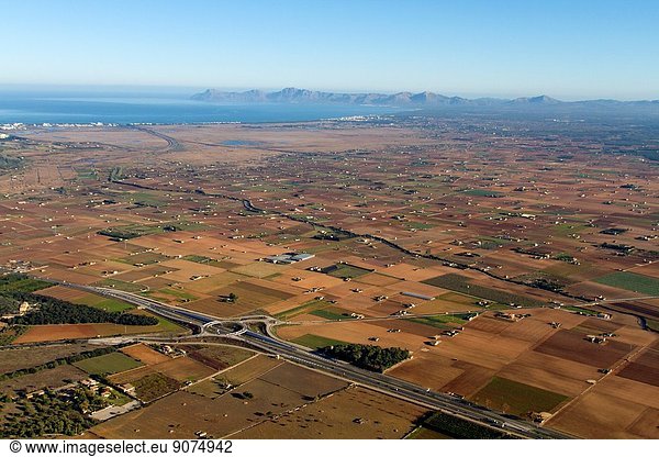 Aerial view of Mallorca  the land and the Alcudia Bay at the botton Balearic Island  Spain.
