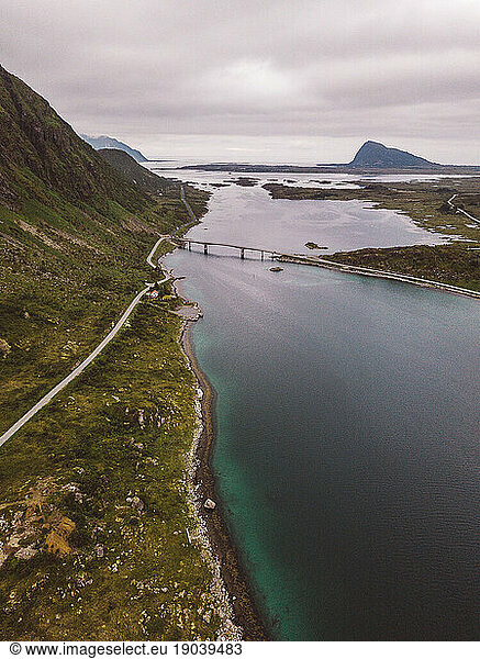 Aerial view of mountains  coast line  roads and a bridge