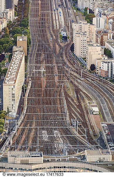 Aerial view of multiple train tracks running into Paris.