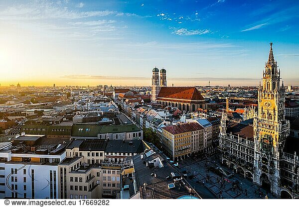 Aerial view of Munich  Marienplatz  Neues Rathaus and Frauenkirche from St. Peter's church on sunset. Munich  Germany