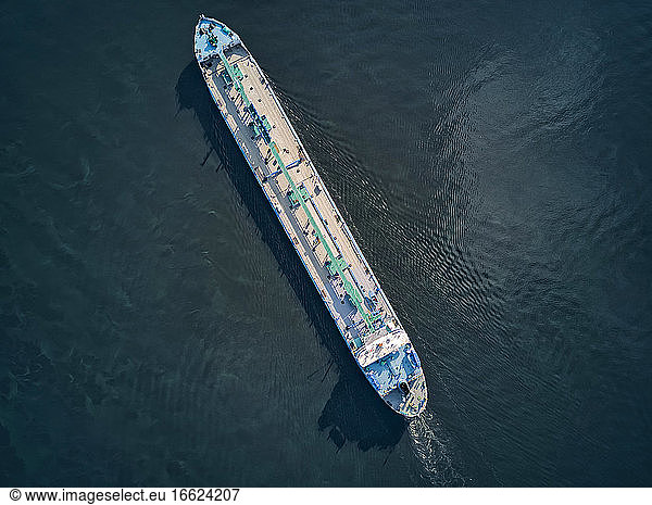 Aerial view of oil tanker moving on Volga River