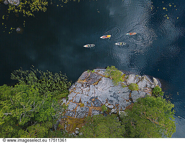 Aerial view of paddleboarders on bank of Vuoksi river