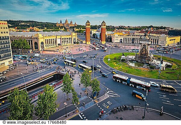 Aerial view of Placa d'Espanya  Plaza de Espana  the Spanish Square in Barcelona  Catalonia  Spain with city traffic on sunset