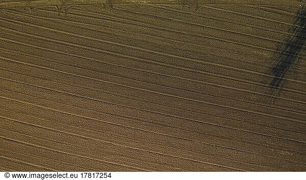 Aerial view of plowed agricultural field ready for planting
