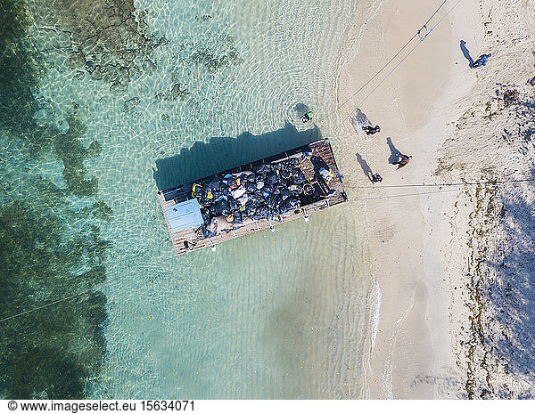 Aerial view of pontoon transporting garbage at Gili Islands, Bali, Indonesia