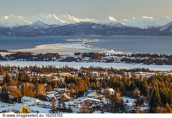 Aerial view of the city of Homer and the Homer Spit in Kenai Peninsula Borough  in Kachemak Bay in winter with the Kenai Mountain Range in the distance; Kenai Peninsula  Alaska  United States of America