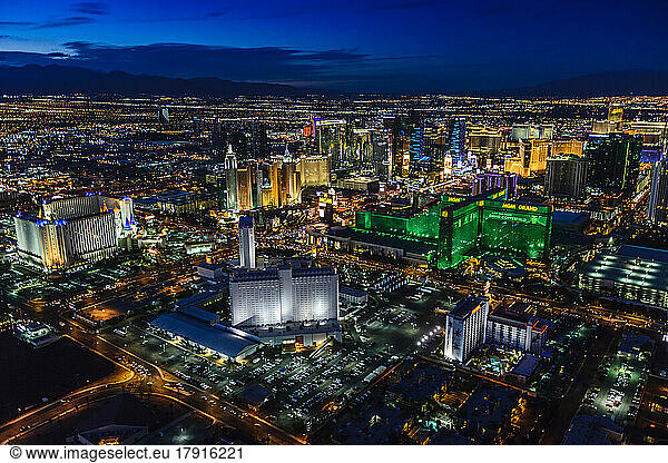 Aerial view of the city of Las Vegas at dusk  city lights and tall buildings of the travel destination.
