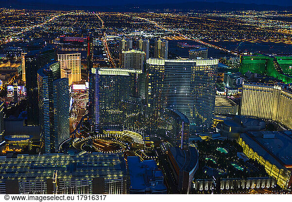 Aerial view of the city of Las Vegas at dusk  city lights and tall buildings of the travel destination.