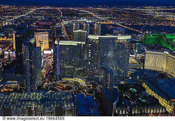 Aerial view of the city of Las Vegas at dusk  city lights and tall buildings of the travel destination.