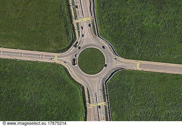 Aerial view of traffic circle on sunny day