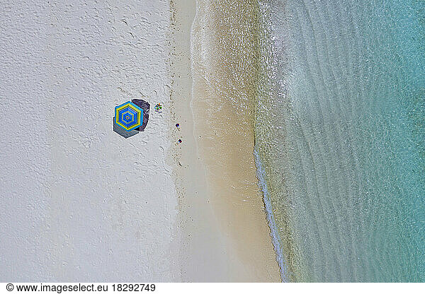 Aerial view of umbrella on shore at beach