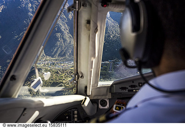 aeroplane cockpit flying in towards lukla airport in nepal