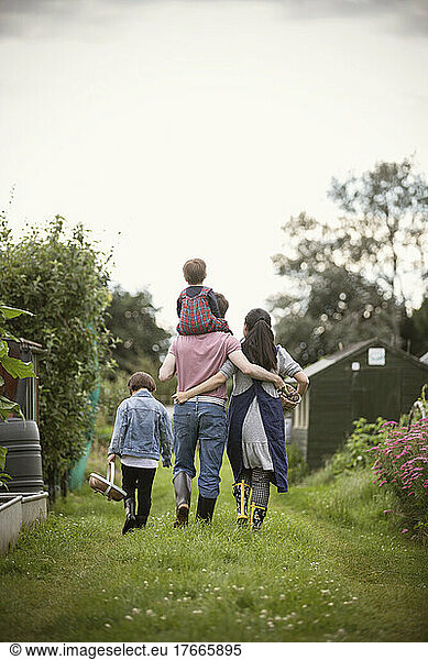 Affectionate family walking in garden