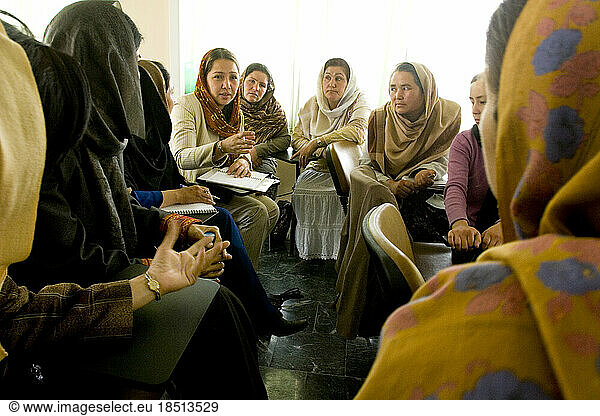 Afghan women attend a business training seminar.