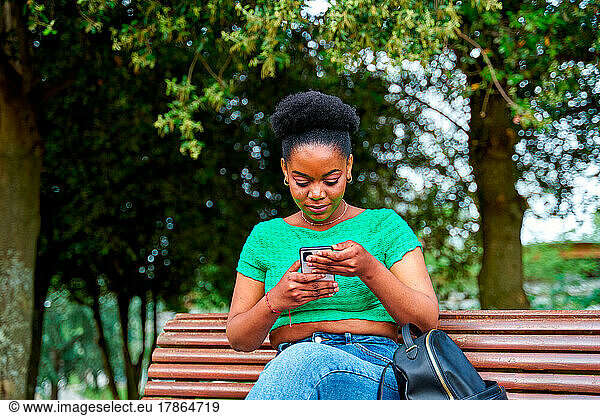 African american woman chatting in the park