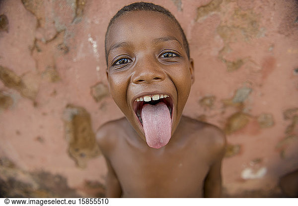 Afro-Brazilian boy stick tongue out in joyful moment