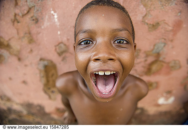 Afro-Brazilian boy with mouth open in joyful moment
