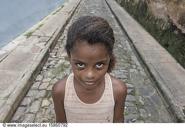 Afro-Brazilian girl in the cobblestone streets of Sao Luis do Maranhao