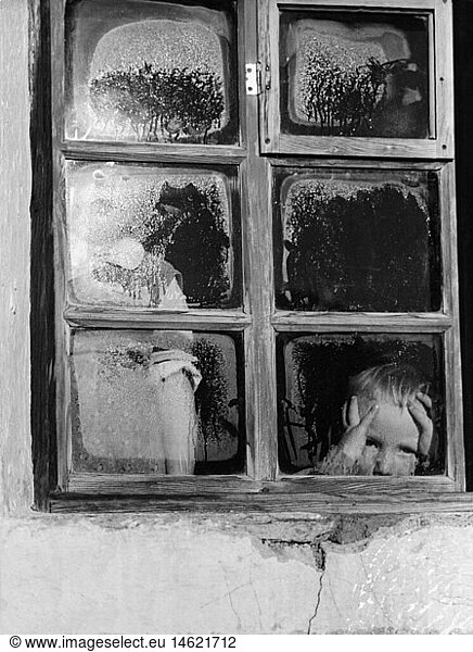 agriculture  mountain farmers  children behind steamy window pane  1950s