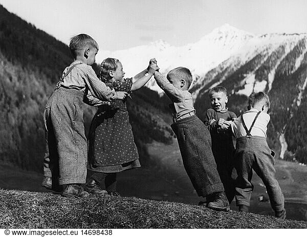 agriculture  mountain farmers  group of little children playing  1950s