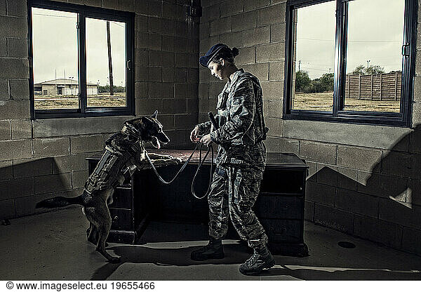 Air Force Security Forces K-9 handler  and her military working dog  seek out drugs inside a training house.
