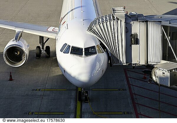 Aircraft Swiss With Docked Passenger Boarding Bridge Aircraft Swiss aircraft-swiss-with-docked-passenger-boarding-bridge-aircraft-swiss