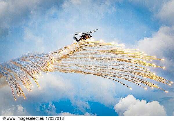 Airmen assigned to the 347th Rescue Group drop flares from an HH-60G Pave Hawk during a fini-flight for Col. Bryan Creel  347th RQG commander at Moody Air Force Base  Ga.   June 5  2020. The fini-flight is a long-standing Air Force tradition that occurs when a pilot departs from an assigned unit.