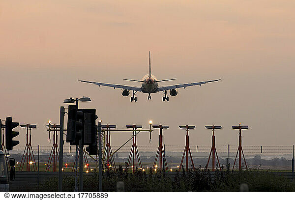 Airplane Airbus Approaching Heathrow At Sunset.