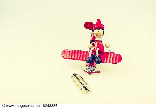 Airplane  Bullet and wooden pinocchio with his long nose