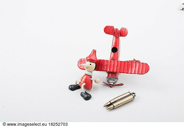 Airplane  Bullet and wooden pinocchio with his long nose