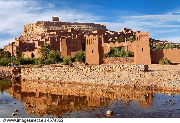 Ait Benhaddou reflected in the water of Ounila River or Wadi Mellah near Ouarzazate Morocco