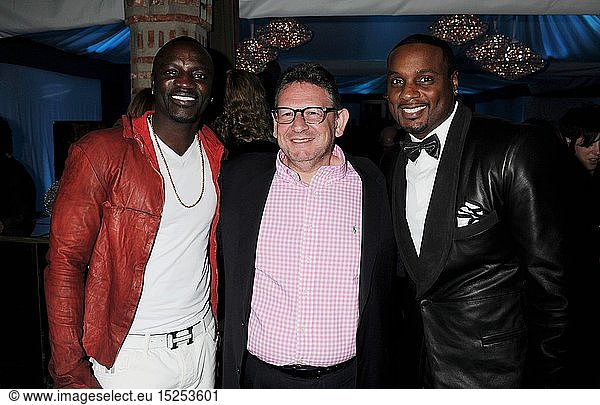 Akon  Lucian Grainge  Chairman & CEO of Universal Music Group and Devyne Stephens attend the Universal Music Group Chairman & CEO Lucian Grainge's annual Grammy Awards viewing party on February 10  2013 in Brentwood  California.