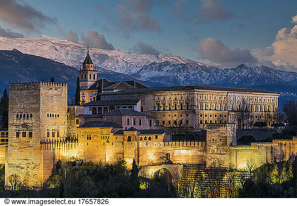 Alhambra palace with Sierra Nevada mountain range behind  Granad