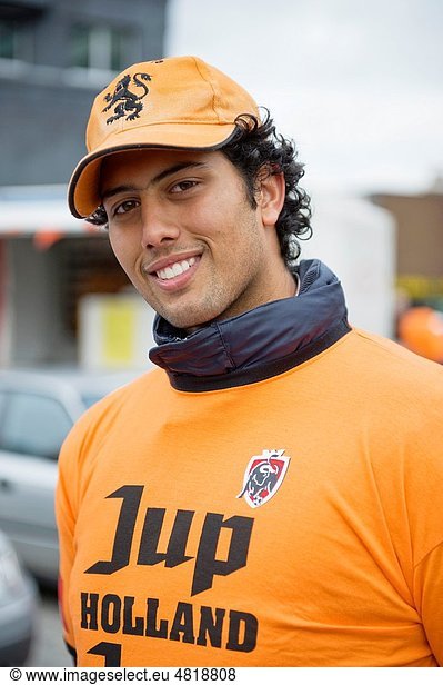 All kinds of people dress in orange close during Queensday in the Netherlands